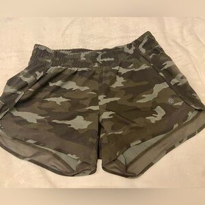 Athleta 4in running shorts, green camo